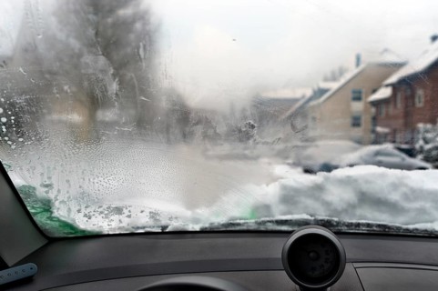 View through a steamed-up windscreen in winter