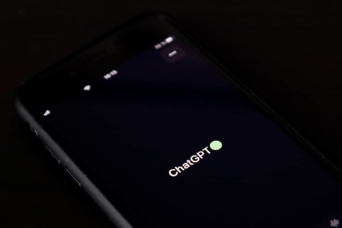 Symbolic image artificial intelligence, detailed view of a smartphone with the app ChatGPT,