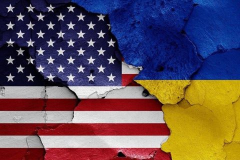 Flags of USA and Ukraine painted on cracked wall