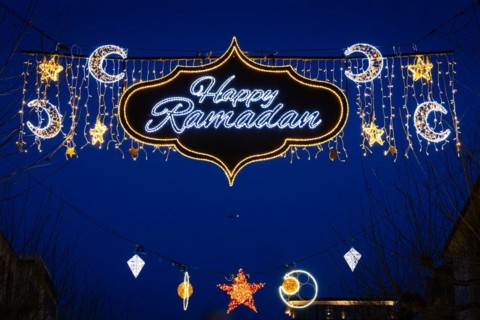 The illuminated lettering Happy Ramadan shines on the evening of 10 March 2024 as part of a light