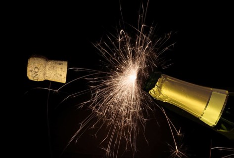 Champagne bottle cork pops on new year's eve