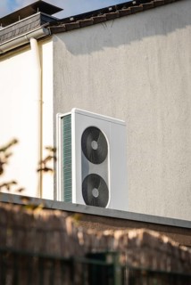 A heat pump on the roof of a garage in Langenfeld, Germany, Europe