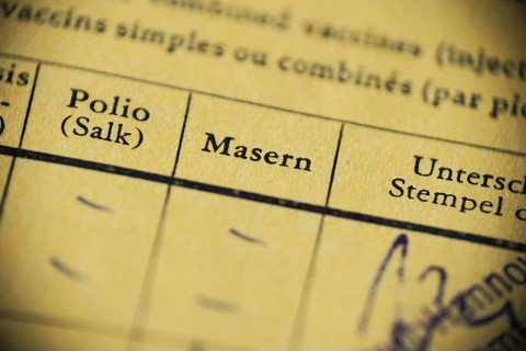 Masern is German for measels - international certificate of vaccination - anti-vaccination concept