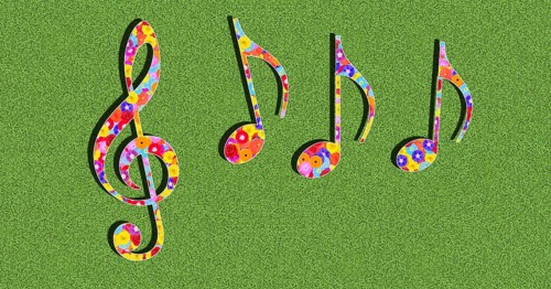 Graphic with clef and notes as a symbol for music with colourful flowers on a green background in