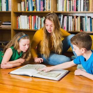 Kids looking pictures library book