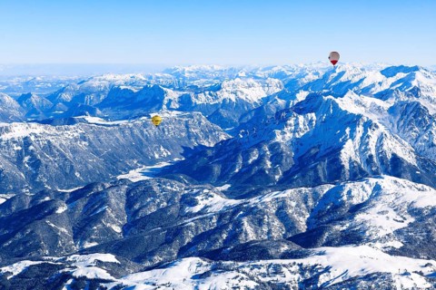 Hot air balloons flying over the Alps, Unterinntal, Tyrol, Austria, Europe