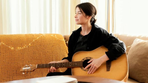 Creative musician practicing indoors 4