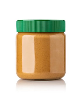 Jar of peanut butter on a white background