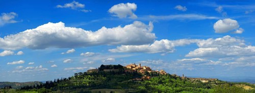Panorama panoramic town view, cityscape of Montepulciano with blue sky and white clouds, Tuscany,
