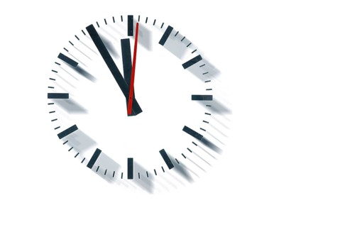 A simple clock or dial, the hands indicating five to twelve and indicating it is high time