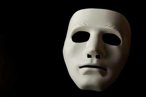 White mask isolated on black background