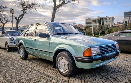 Lisbon, Portugal, Jan 20, 2024: A classic light green Ford Escort 3rd generation car known as