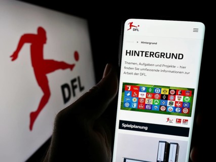 Stuttgart, Germany, 12-07-2023: Person holding cellphone with webpage of German football company