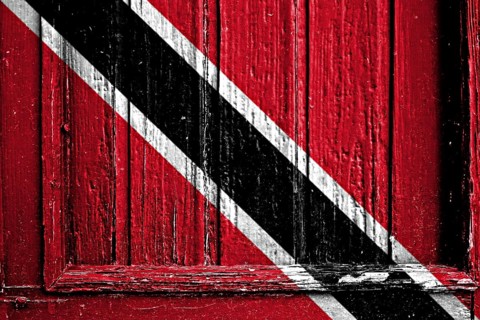 Flag of Trinidad and Tobago painted on wooden frame