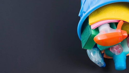 Cleaning products basket black background