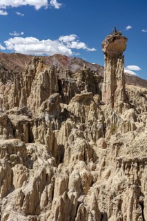 Earth pyramids with rocks on top, called Demoiselles Coiffées, precariously balanced rocks in Valle