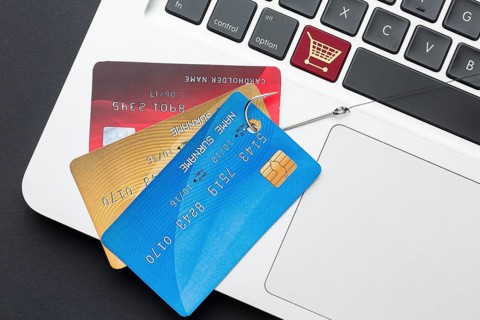 Top view laptop with credit card phishing hook