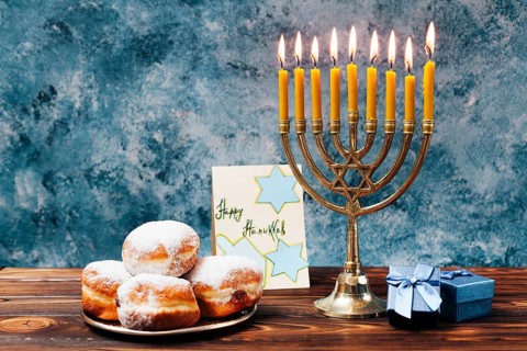 Traditional hanukkah sweets with candles