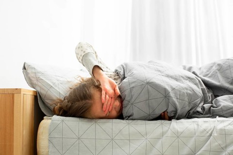 Front view sleeping girl waking up