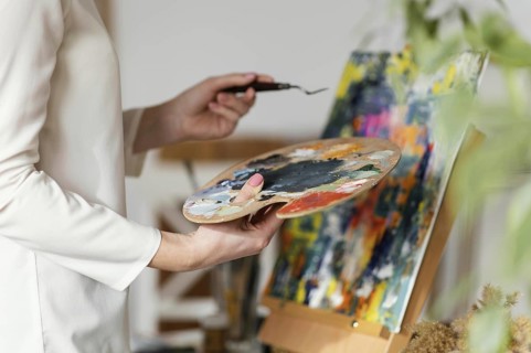 Young blonde woman painting with acrylics. Resolution and high quality beautiful photo