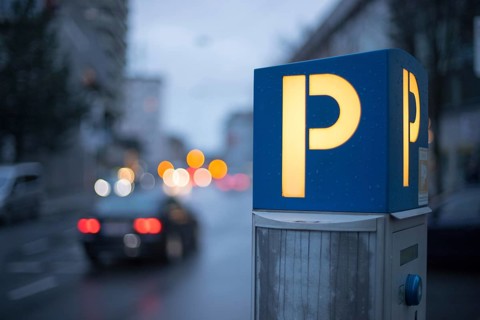 Parking machine in the city street, evening