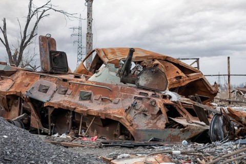 Burnt tank and destroyed buildings of the Azovstal plant shop in Mariupol war in Ukraine with