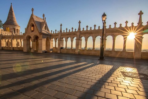 Old historic fortress and church at sunrise. City panorama at dusk. View of the Danube Fishermen's