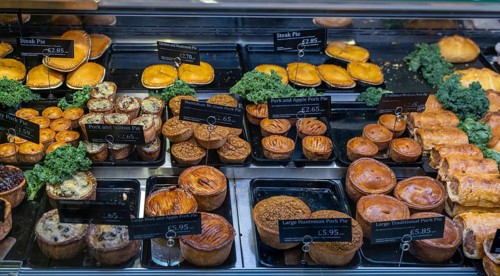 Conwy, United Kingdom, 27 August, 2022: close-up view of a butcher shop showcase with a variety of