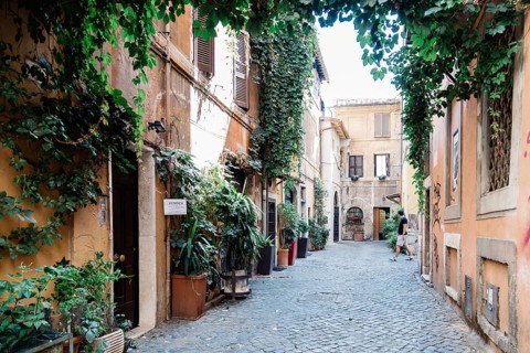 Rome, Italy, August 20, 2016: Picturesque pedestrian street in Trastevere a sunny summer day in