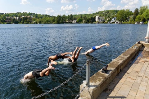 Summer, boys jumping into a lake, Saint Agathe, Province of Quebec, Canada, North America