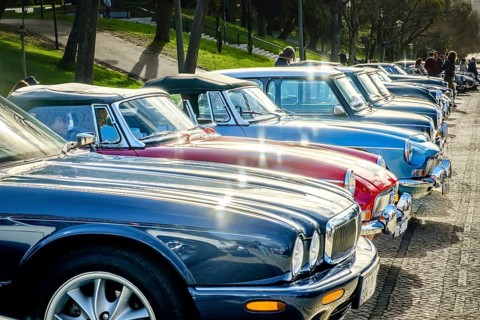 Lisbon, Portugal, Jan 20, 2024: A row of shiny vintage cars of Jaguar, MG, Triumph and Mini brands