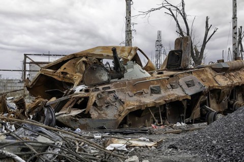 Burnt tank and destroyed buildings of the Azovstal plant shop in Mariupol war in Ukraine with