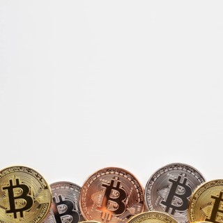 Bitcoin with various colors plain background