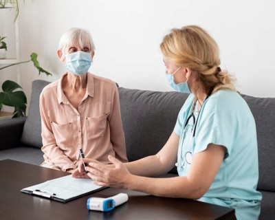 Nurse elder woman conversing nursing home