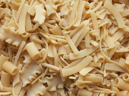 Mixed pasta of various shapes background