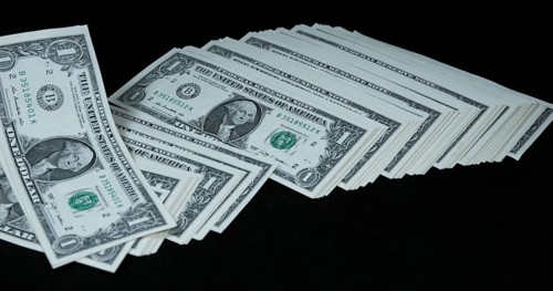 1 US Dollar Banknotes falling against Black background