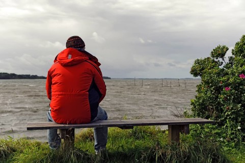 Lonely man on the shore of the Groensund