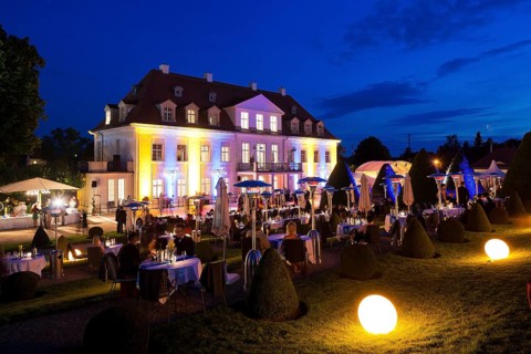 Summer night ball at Wackerbarth Castle. Schloss Wackerbarth or Wackerbarths Ruh' is a baroque