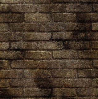 A rustic brown brick wall with a rough texture and uneven coloring, presenting an old and weathered