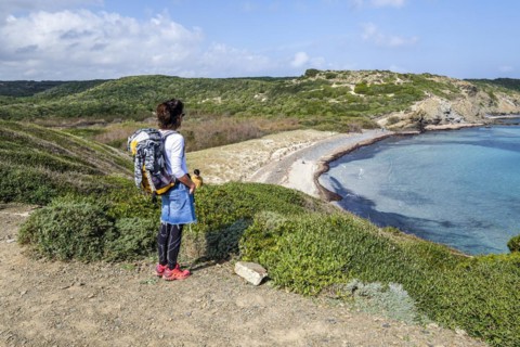 Hiker on Tortuga beach, s'Albufera des Grau Natural Park, Menorca, Balearic Islands, Spain, Europe