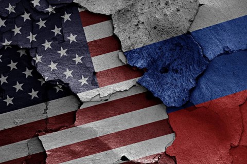 Flags of USA and Russia painted on cracked wall