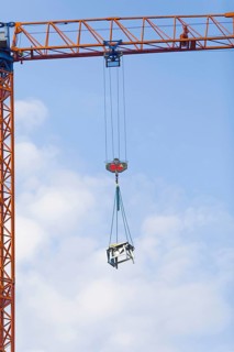 Circular table saw suspended from a crane