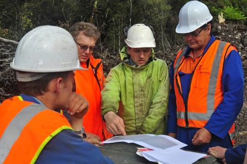Geologists discuss the oil-bearing formation being explored in a seismic reflective survey on the