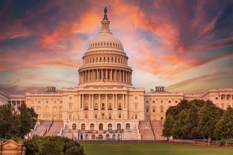 Violet sunset sky over the US Capitol building dome