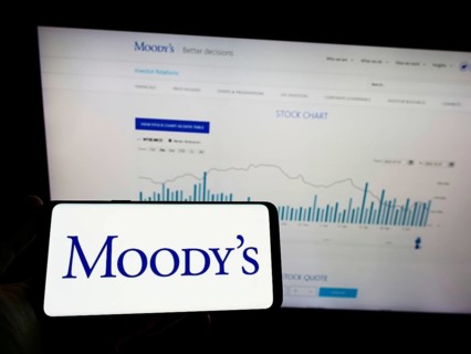 Stuttgart, Germany, 10-09-2022: Person holding mobile phnoe with logo of rating company Moody's