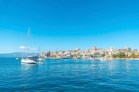 Tourist boats on the beaches of the city of Sarande or Saranda on the Albanian riviera seen from a