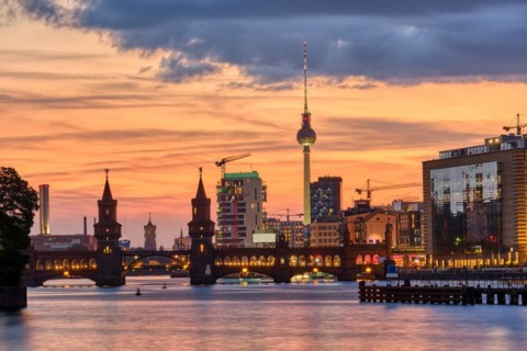 Beautiful sunset at the Oberbaum Bridge and the famous TV Tower in Berlin