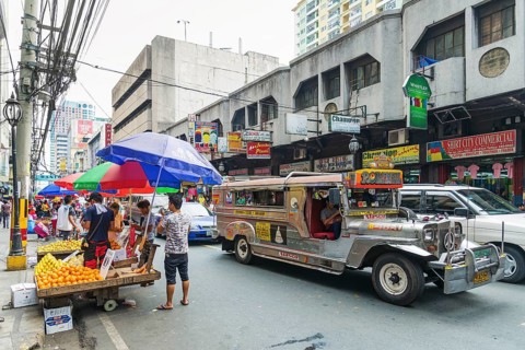Local colourful jeepney bus in manila chinatown street in philippines