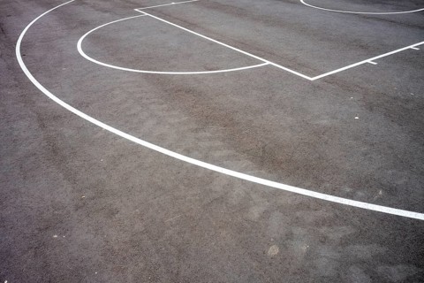 Basketball court lines on the asphalt