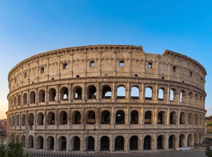 Colosseum at sunrise in Rome, Italy, Europe. Rome ancient arena of gladiator fights. Rome Colosseum